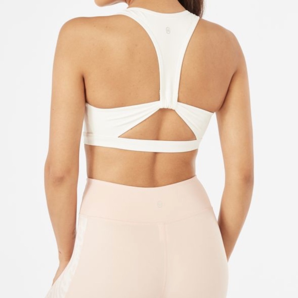 White Open Back Sports Bra with peep hole detail.